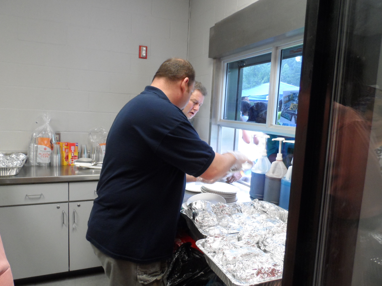 Andew Zagars helping serve